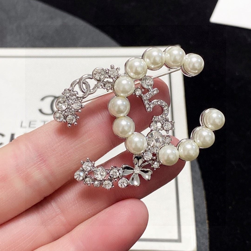 Ch**el brooches
